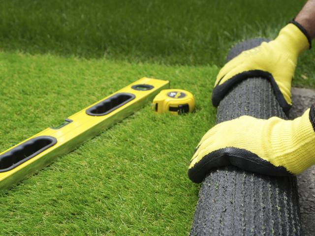 measuring artificial grass man measuring artificial grass