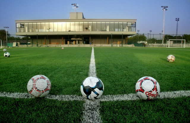 artificial grass sports pitch astroturf and or artificial grass sports pitch with footballs on