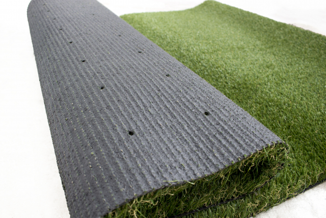 artificial grass drainage holes an image to show the latex backing of artificial grass and the drainage holes